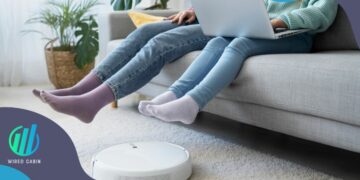 Robots: Image of girls sitting while the cleaning robot works
